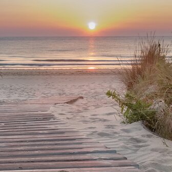 Strand fotobehang Avondzon OPRUIMING